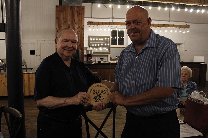 <p>Democrat photo/Austin Hornbostel</p><p>Paul Jungmeyer, left, presents Moniteau County Historical Society President Steve Weicken with the 2021 “Spirit of the Manitou” award. The honor is given to members who demonstrated “outstanding devotion to the organization” during the past year.</p>