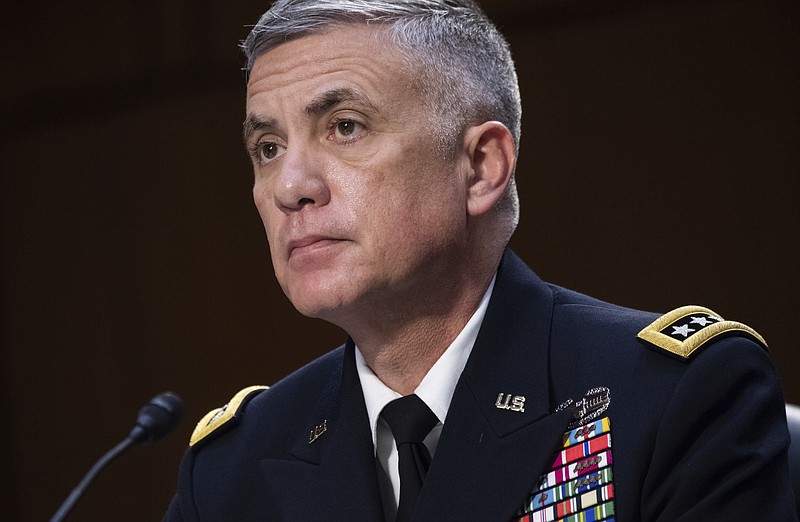 FILE - In this April 14, 2021, file photo National Security Agency (NSA) Director Gen. Paul Nakasone testifies during a Senate Select Committee on Intelligence hearing about worldwide threats, on Capitol Hill in Washington. Nakasone who leads U.S. efforts to thwart and punish foreign-based cyberattacks says he’s mounting a new “surge” to fight incursions that have at times debilitated government agencies and companies responsible for critical infrastructure. In an interview, Nakasone broadly described “an intense focus” by government specialists to better find and share information about cyberattacks and “impose costs when necessary.” (Saul Loeb/Pool via AP, File)