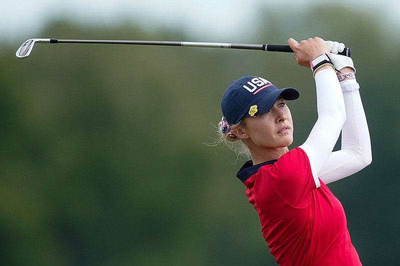 United States' Nelly Korda watches her tee shot during the foursome matches at the Solheim Cup golf tournament, Sunday, Sept. 5, 2021, in Toledo, Ohio. (AP Photo/Carlos Osorio).