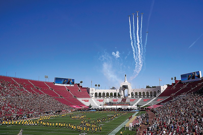 Airplanes fly above Los Angeles Memorial Coliseum before a game earlier this month between San Jose State and USC in Los Angeles.