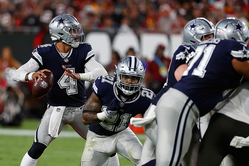 Dallas Cowboys quarterback Dak Prescott (4) looks to pass against the Tampa Bay Buccaneers during the first half of an NFL football game Thursday, Sept. 9, 2021, in Tampa, Fla. (AP Photo/Scott Audette)