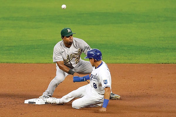 Nicky Lopez of the Royals beats the tag by Athletics shortstop Elvis Andrus at second base during Wednesday night's game at Kauffman Stadium.