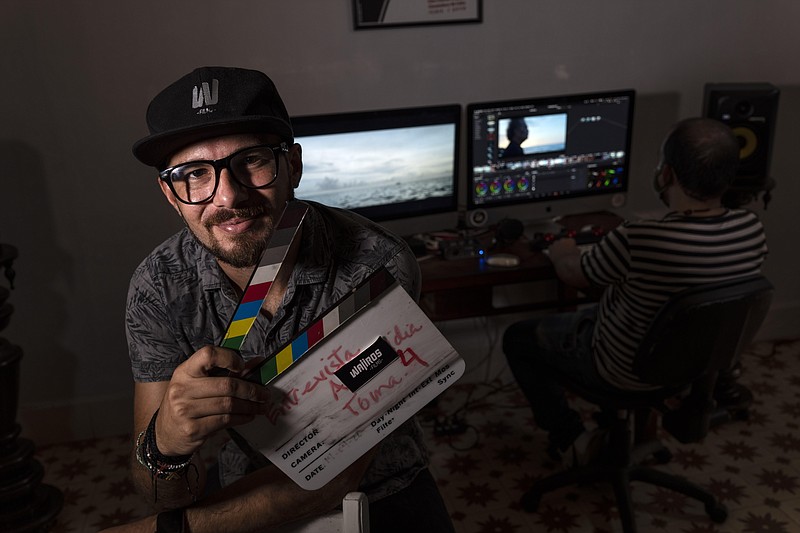 <p>AP Photo/Ramon Espinosa</p><p>Carlos Gomez, 35, owner of the audiovisual production company Wajiros Films, poses for a photo at his company’s editing room in Havana, Cuba, Thursday, Sept. 2, 2021. Most sorts of private businesses have been banned for more than 50 years, but now a new legal system takes effect on Sept. 20 that could greatly expand the scope of private businesses like Gomez´s, and crucially give them greater legal certainty in efforts to help an economy in crisis.</p>
