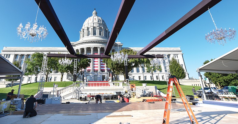 <p>Julie Smith/News Tribune</p><p>Staff of Fogarty, Inc. have been working through the week to transform the Capitol’s north drive into a formal event center featuring lighting, red carpet, large tents and the construction of a dance floor for the evening’s inaugural ball. The inauguration festivities were moved to September to coincide with Missouri’s Bicenetennial celebration and for people to be able to gather outdoors for the celebration. Saturday’s festivities begin at 10 a.m. with a parade followed by the Grand March at 6 p.m. on the north side of the Capitol.</p>