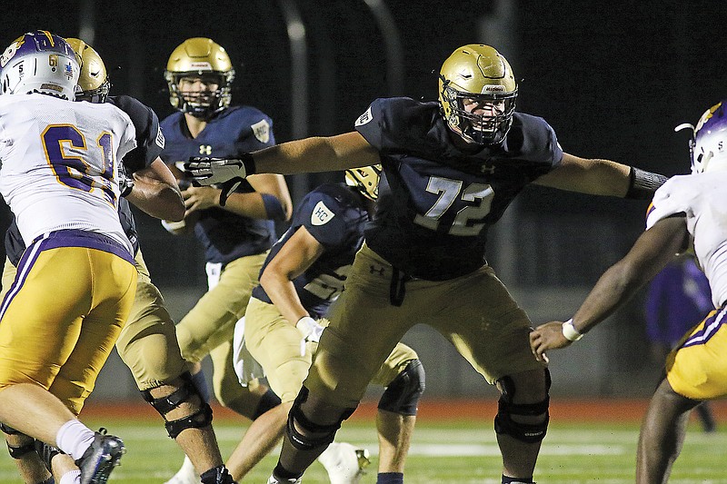 Helias offensive lineman Jack Klebba gets set in pass protection as quarterback Drew Miller drops back and looks for a receiver to throw to during a game earlier this month against Hickman at Ray Hentges Stadium.