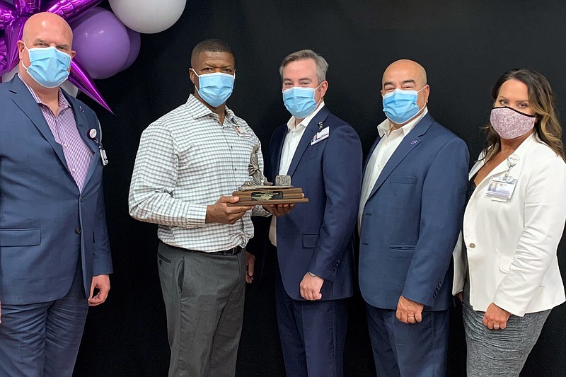 Tim Hall, second from left, receives CHRISTUS Health's Diversity, Equity and Inclusion Leadership Award from company officials, from left, Glen Boles, Jason Adams, Marcos Pesquera and Tara Gunn.
