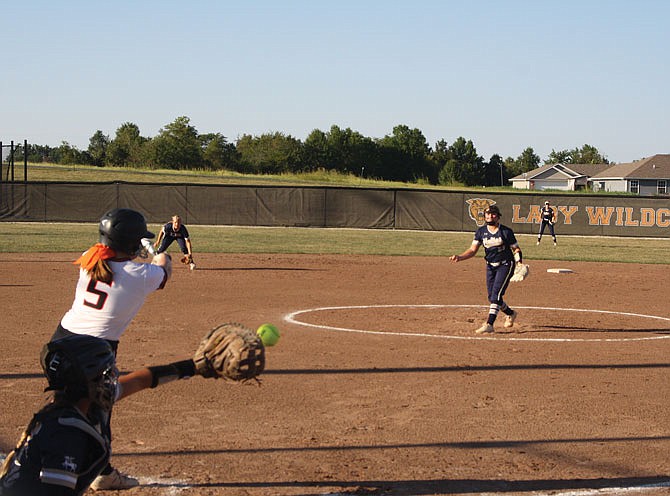 New Bloomfield senior Lelah Shikles strikes out to end the second inning Thursday in the Lady Wildcats's 8-0 loss to Helias. Lady Crusaders freshman pitcher Cambri Van Loo ended one of New Bloomfield's scoring threats in the second and kept the Lady Wildcats off the board through seven.