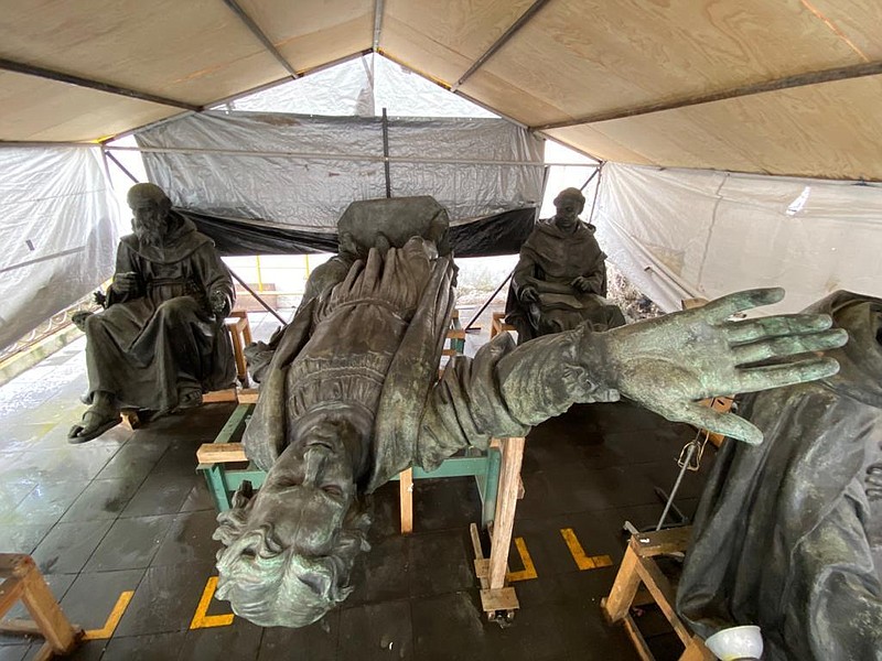 This Aug. 2021 photo released by Mexico's National Institute of Anthropology and History (INAH) shows the statues that make up the Christopher Columbus monument laying in an area where they are under restoration before their relocation in Mexico City. (INAH via AP)