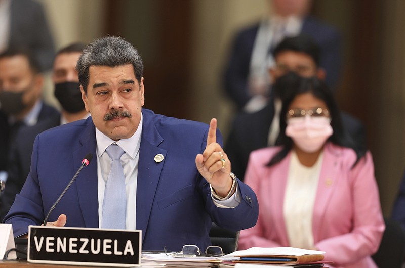 In this handout photo provided by the Miraflores Press Office, Venezuela's President Nicolas Maduro speaks at the Community of Latin American and Caribbean States, or CELAC summit, in Mexico City, Saturday, Sept. 18, 2021. (Miraflores Press Office via AP)