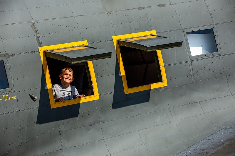 Joseph Christmann Wolfe, 5, looks out the window of the C47 transport plane on Saturday, September 18, 2021 at the Jefferson City airport. Christmann Wolfe’s favorite vehicle at the airshow was the Blackhawk helicopter. (Ethan Weston/News Tribune photo)