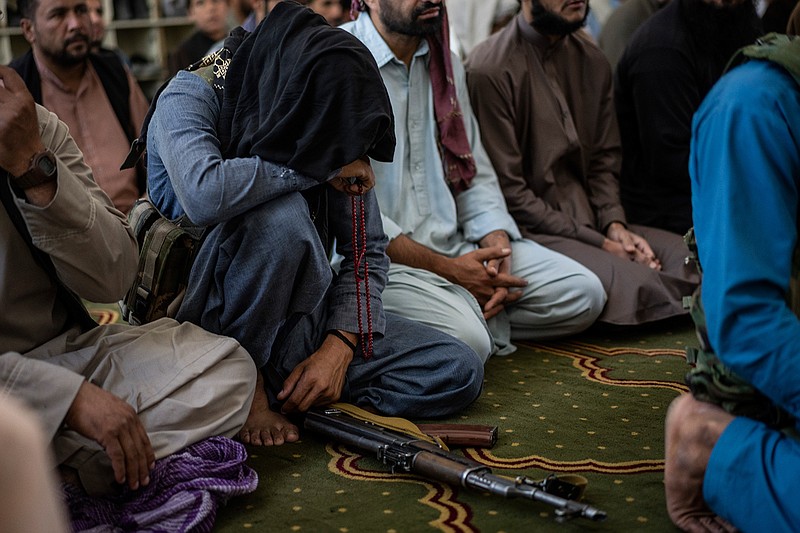 A member of the Taliban prays inside a mosque during Friday prayers in Kabul, Afghanistan, Friday, Sept. 17, 2021. (AP Photo/Bernat Armangue)