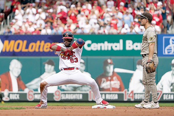 Edmundo Sosa of the Cardinals celebrates alongside Padres second baseman Adam Frazier after hitting an RBI double during the first inning of Sunday afternoon's game at Busch Stadium.
