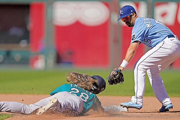 Jake Fraley of the Mariners is forced out at second by Royals second baseman Whit Merrifield during the fifth inning of Sunday afternoon's game at Kauffman Stadium.