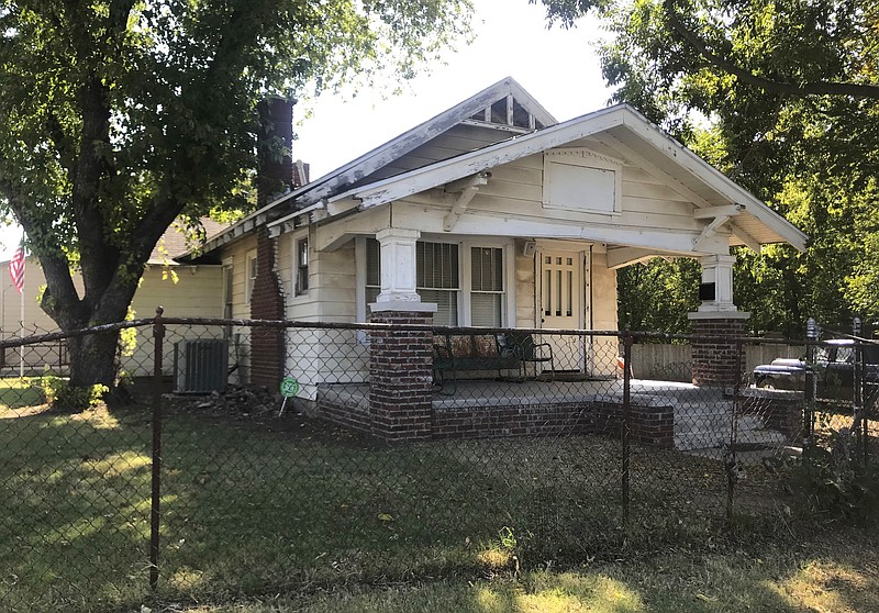 The exterior of a home used for the 1983 film “The Outsiders,” based on S.E. Hinton's classic 1967 novel, appears in Tulsa, Okla., Tuesday, Sept. 14, 2021. The home, which was purchased by rapper Danny Boy O'Connor, was converted into The Outsiders House Museum. (AP Photo/Kristi Eaton)