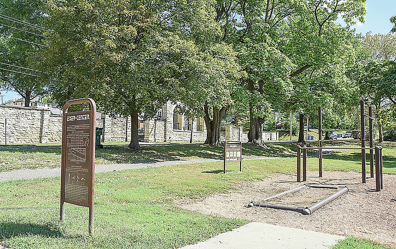 The stone wall that forms the south boundary of the National Cemetery in Jefferson City on East Miller Street, is seen in the background, just across the street from the East Miller Neighborhood  Park. A city proposal calls for the National Cemetery to expand and the park to be relocated.