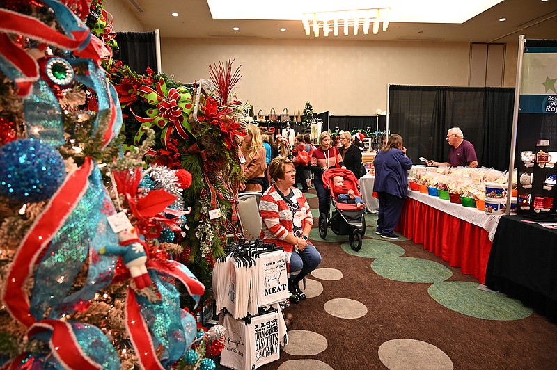 Holiday shoppers browse the booths and products at the Junior League's annual Mistletoe Market in 2019. COVID caused its cancellation in 2020 and now this year.