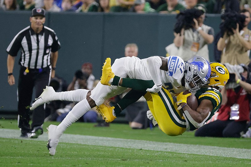 Detroit Lions' Tracy Walker III stops Green Bay Packers' Randall Cobb after a catch during the second half of an NFL football game Monday, Sept. 20, 2021, in Green Bay, Wis. (AP Photo/Mike Roemer)