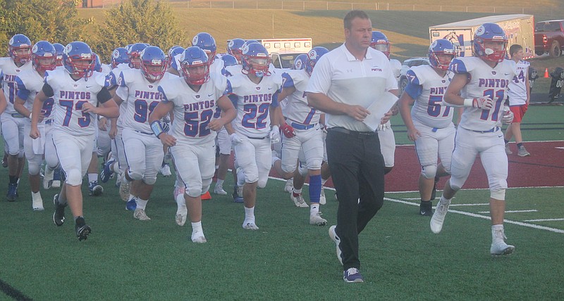 <p>Democrat photo/Evan Holmes</p><p>California head coach Seth Womack leads his Pintos into battle Friday night.</p>