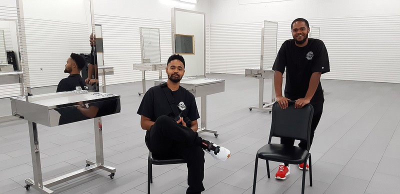 Charles, left, and Ben House are brothers and owners/operators of Tonsorial Barber Arts College in Oaklawn Village. They have just expanded their space.
