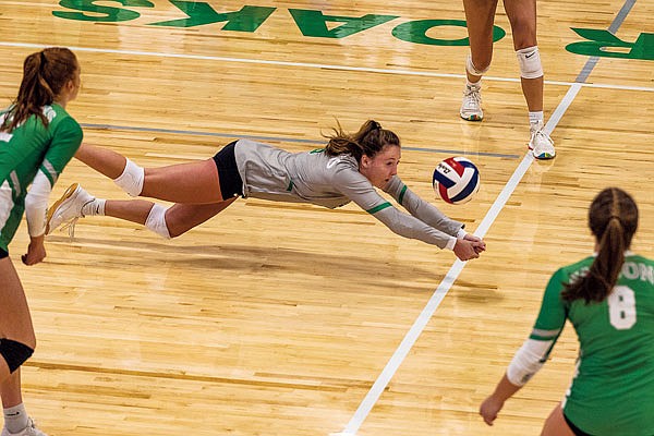 Payton Mitchell of Blair Oaks dives for a ball during Tuesday night's match against Jefferson City in Wardsville.