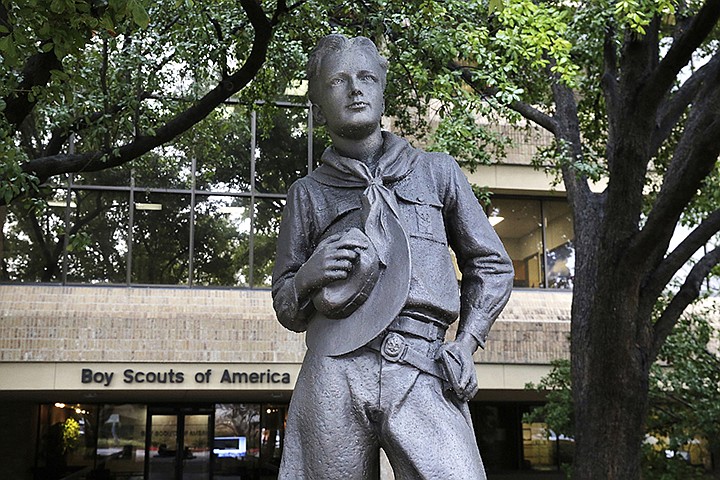 In this Feb. 12, 2020, file photo, a statue stands outside the Boy Scouts of America headquarters in Irving, Texas. One of the primary insurers of the Boy Scouts of America announced Tuesday, Sept. 14, 2021, that it has reached a tentative settlement agreement with the organization and with attorneys representing tens of thousands of men who say they were molested as youngsters decades ago by scoutmasters and others. (AP Photo/LM Otero, File)
