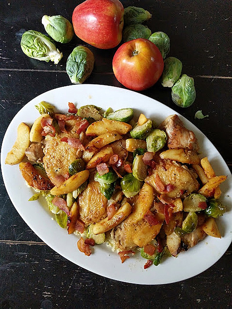 Chicken thighs braised in hard cider with Brussels sprouts and apples makes an easy one-pan fall dinner. (Gretchen McKay/Pittsburgh Post-Gazette/TNS)
