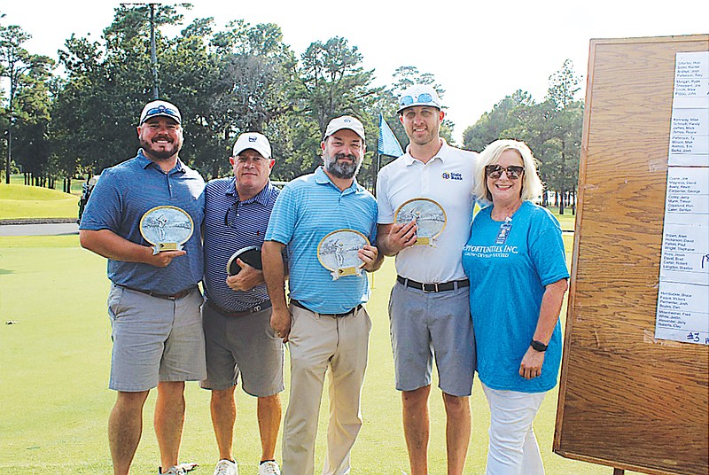 First-place winners from left: Braxton Langdon, Robbie Carter, Brad Davis and Jason Ross, with Executive Director Sherry Young.