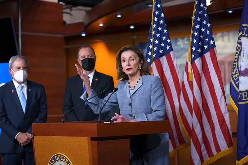 Speaker of the House Nancy Pelosi, D-Calif., joined from left by House Budget Committee Chair John Yarmuth, D-Ky., and House Intelligence Committee Chairman Adam Schiff, D-Calif., talks to reporters about the "Protecting Our Democracy Act" which will curb the power of the president in an effort to rein in executive powers that they say President Donald Trump abused, at the Capitol in Washington, Tuesday, Sept. 21, 2021. (AP Photo/J. Scott Applewhite)
