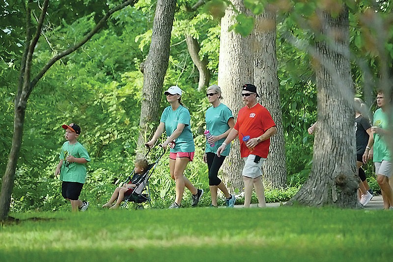News Tribune fileParticipants walk in the 2018 Miles Against Melanoma 5K event, which was at Memorial Park. This year's event is Saturday at Ellis-Porter Riverside Park. 