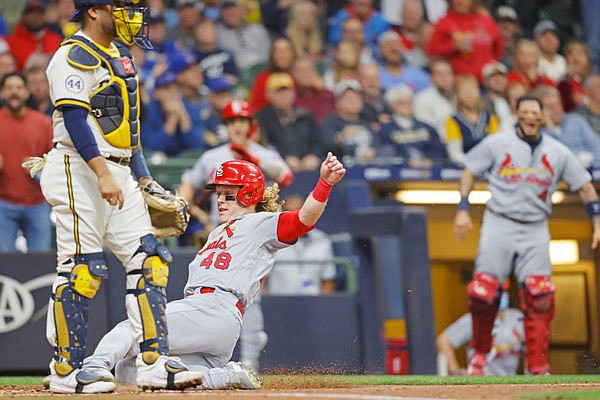Harrison Bader of the Cardinals scores from second base on Tommy Edman fly out during the second inning of Wednesday night's game against the Brewers in Milwaukee.