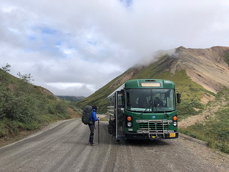 A backpacker steps off the camper bus in Denali National Park before venturing into the Alaska backcountry. (Photo for The Washington Post by Cristina Moody)