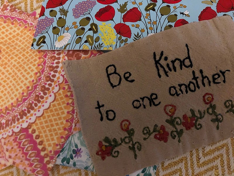 Be kind to one another " Debra-Lynns friend sent a piece for her healing quilt from a tattered dish cloth shed saved for years. The pink pieces are remnants from the gowns her obstetrician custom-made so her patients didnt have to wear paper gowns. (Debra-Lynn Hook/TNS)