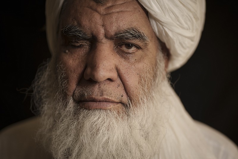 Taliban leader Mullah Nooruddin Turabi poses for a photo in Kabul, Afghanistan, Wednesday, Sept. 22, 2021. Mullah Turabi, one of the founders of the Taliban, says the hard-line movement will once again carry out punishments like executions and amputations of hands, though perhaps not in public. (AP Photo/Felipe Dana)