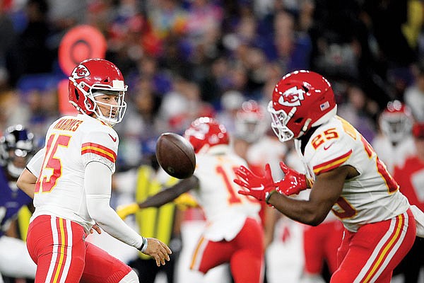 Chiefs quarterback Patrick Mahomes pitches to running back Clyde Edwards-Helaire during last Sunday night's game against the Ravens in Baltimore.