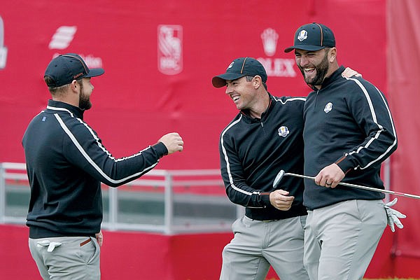 (From left) Team Europe's Tyrrell Hatton, Rory McIlroy and Shane Lowry have some fun on the ninth hole during Thursday's practice round for the Ryder Cup at the Whistling Straits Golf Course in Sheboygan, Wis.