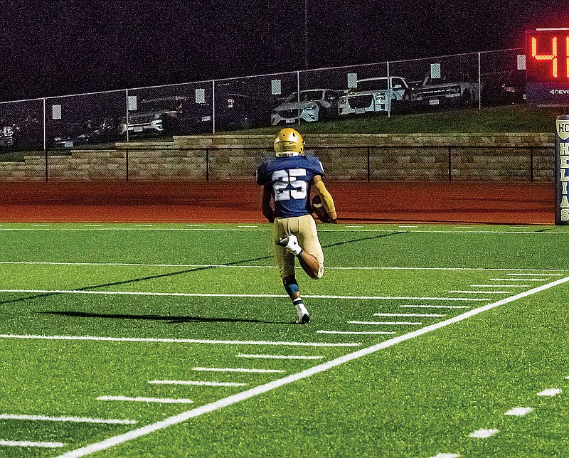 Helias running back Ryan Klahr heads to the end zone for a touchdown during last Friday night's game against Granite City, Ill., at Ray Hentges Stadium.