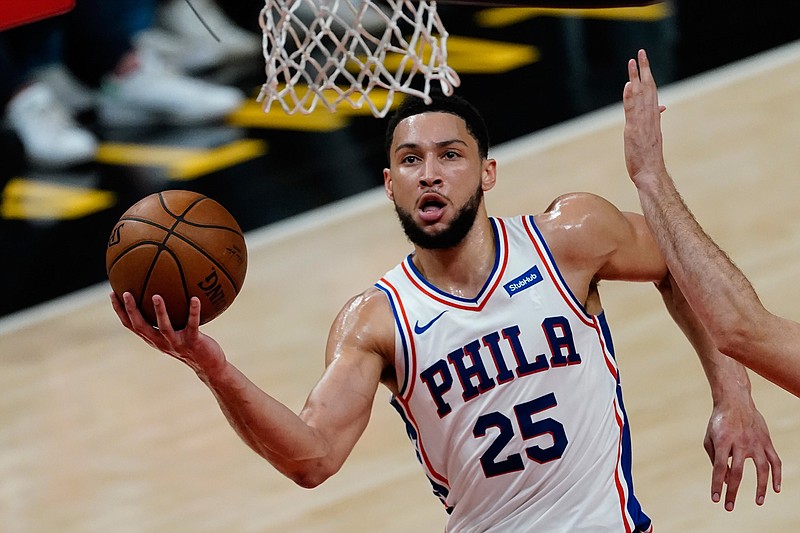 Philadelphia 76ers guard Ben Simmons (25) goes to the basket during their NBA playoff basketball game against the Atlanta Hawks, in Atlanta, in this Saturday, June 12, 2021, file photo. Simmons says he's taking his ball and going home. The 76ers say they still want their disgruntled All-Star guard. (AP Photo/John Bazemore, File)