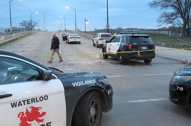 Authorities are investigating an officer-involved shooting following a report of a man with a gun at the foot of the Sixth Street Bridge early Wednesday, April 7, 2021, in Waterloo, Iowa. In a lawsuit filed Thursday, Sept. 23, 2021, a man who was paralyzed when an Iowa police officer shot him in April is suing the officer. Marcelino Alvarez-Victoriano contends the shooting was not justified. Authorities say a Waterloo police officer shot Alvarez-Victoriano after he pointed a pellet gun that looked like a shotgun at two Black Hawk County sheriff's deputies. ( Jeff Reinitz/The Courier via AP)