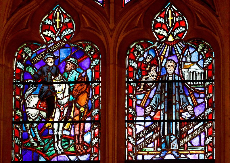 This Wednesday, Sept. 6, 2017 file photo shows stained glass windows depicting two Confederate generals at the Washington National Cathedral. Washington National Cathedral has chosen contemporary artist Kerry James Marshall, renowned for his wide-ranging works depicting African-American life, to design new stained-glass windows with themes of racial justice to replace windows with Confederate imagery that were removed from the landmark sanctuary in 2017. (AP Photo/Carolyn Kaster)