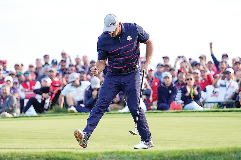 Team USA's Bryson DeChambeau reacts after making a putt on the 15th hole during a four-ball match Friday in the Ryder Cup at the Whistling Straits Golf Course in Sheboygan, Wis.
