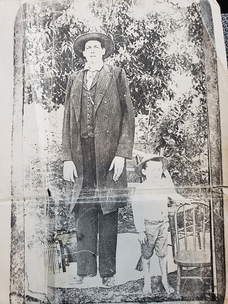 James Wesley "Big Jim" Patterson, at left in each photo, poses for undated photos. At a reported 8 feet, 4 inches tall, Patterson was billed as the world's tallest man when he performed in circus sideshows in the 1890s. He later returned to his home in Bloomburg, Cass County, Texas, to join his prominent family in business ventures that played an important role in developing the town's economy. Researcher and author B.E. Prince, Patterson's great nephew, is writing a book on Patterson based in large part on a trove of family documents, letters and vintage photos.

Photos courtesy B.E. Prince
