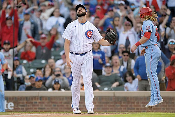 Cubs reliever Tommy Nance reacts after Harrison Bader of the Cardinals scored on a wild pitch during the ninth inning Saturday in Chicago.