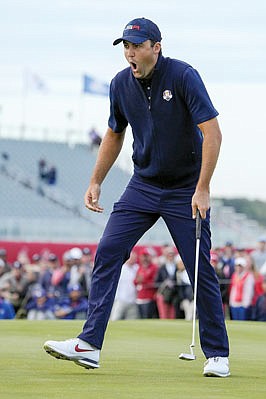 Team USA's Scottie Scheffler reacts to making his putt and winning the 15th hole during a four-ball match Saturday in the Ryder Cup at the Whistling Straits Golf Course in Sheboygan, Wis.