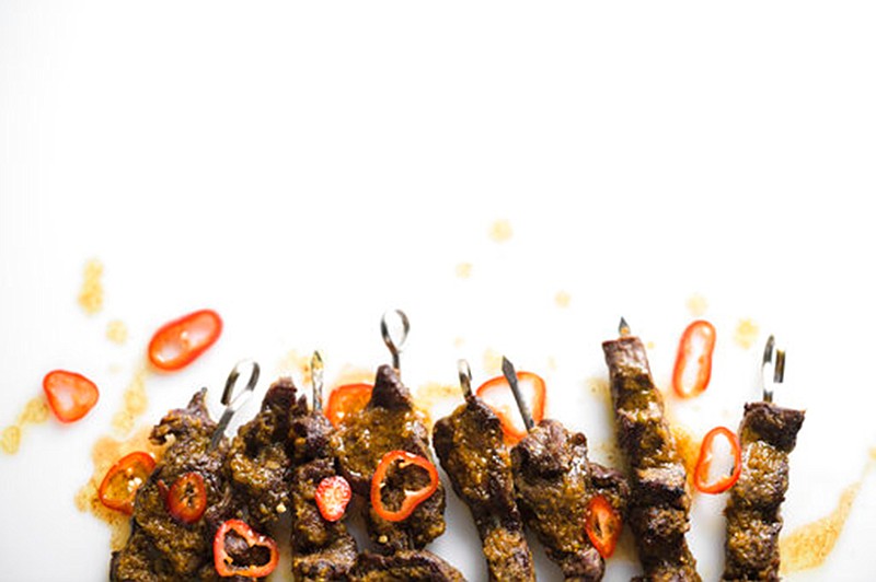 This image released by Milk Street shows a recipe for Curried Beef Skewers. (Milk Street via AP)