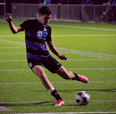 Miles Andrews of Capital City takes a shot during Monday night's game against Missouri Military Academy at Capital City High School.