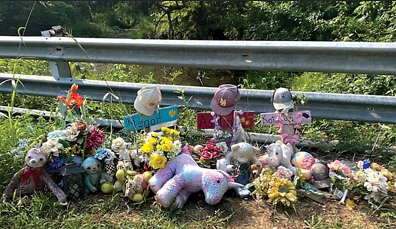 A memorial marks the place on Bowie County Road 3302 where Katie Jo Vaughn, 17, and her two passengers, Megan Daniel, 17, and Ashlin Cox, 19, were killed on Nov. 8, 2020. The mothers of the three girls are asking county commissioners to put a stronger guard rail at the location along with more signs about the curve.