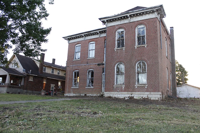 Democrat photo/Austin HornbostelA pair of homes along Oak Street is near-unrecognizable following clean-up work executed by city workers and Tipton Correctional Center inmates' collective efforts. The properties had been condemned since 2019.