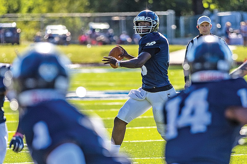 Lincoln quarterback Zamar Brake looks downfield for a receiver during last Saturday's game against Northeastern State at Dwight T. Reed Stadium.