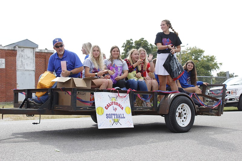 <p>Democrat photo/Austin Hornbostel</p><p>The Lady Pintos softball team helps to bring up the rear of Friday’s parade.</p>