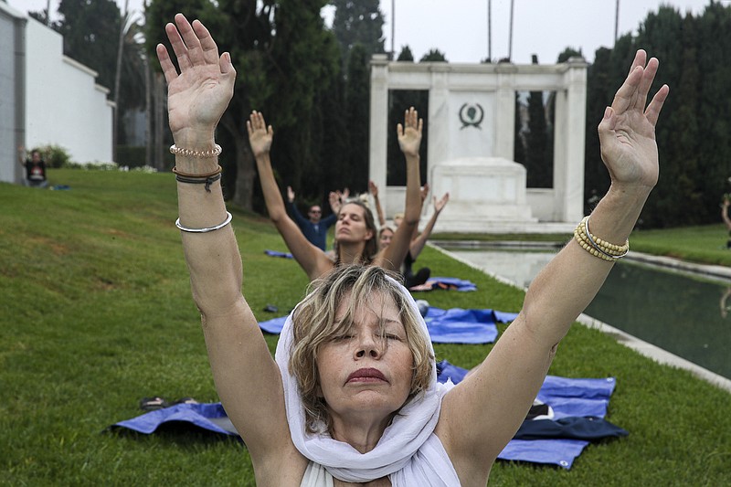 Jennifer Drake takes part in a hypno-yoga class taking place on the grounds of Cathedral Mausoleum at Hollywood Forever Cemetery on Wednesday, Sept. 8, 2021 in Los Angeles, California. (Irfan Khan/Los Angeles Times/TNS)